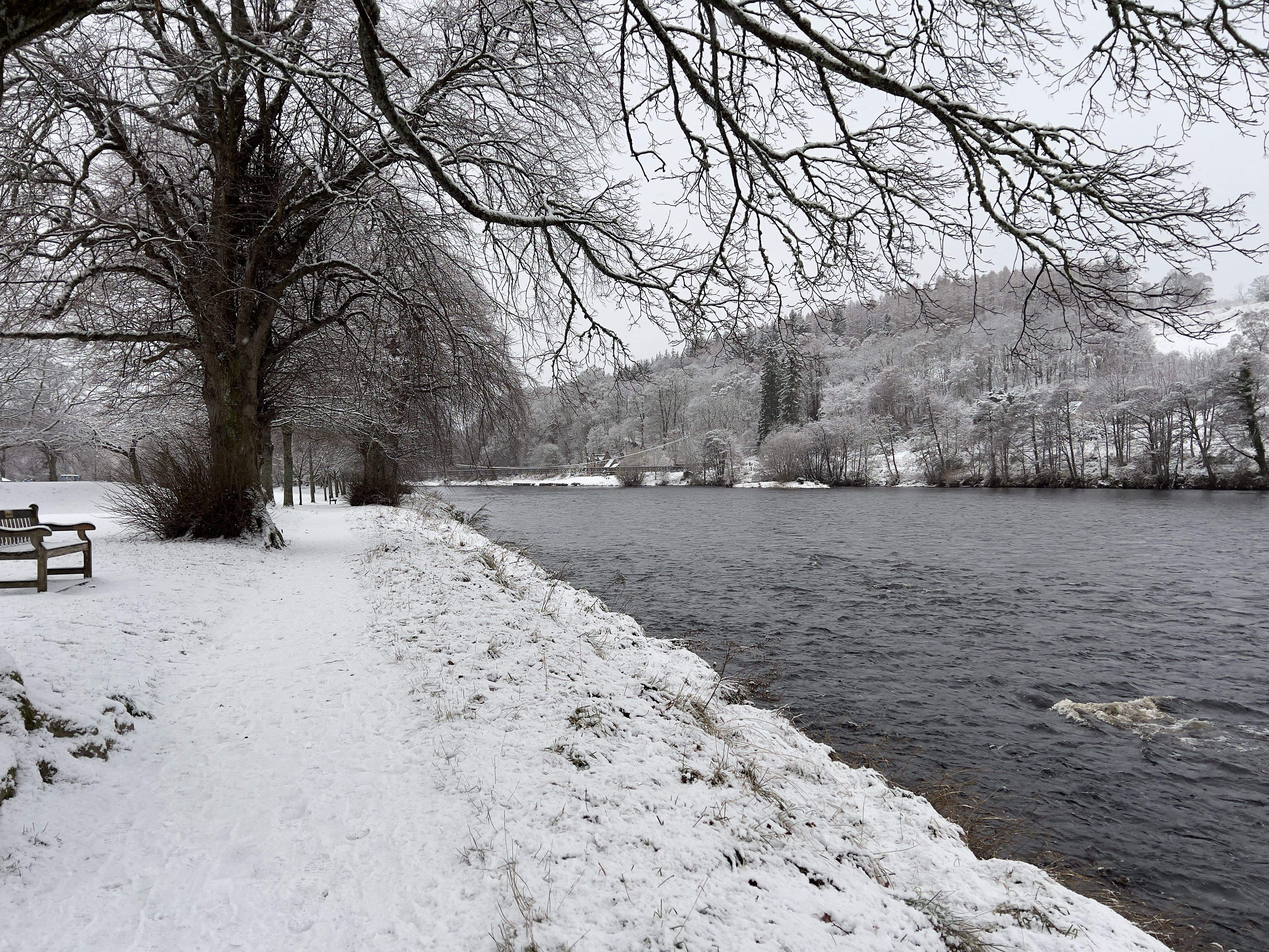 A snowy walk by the river